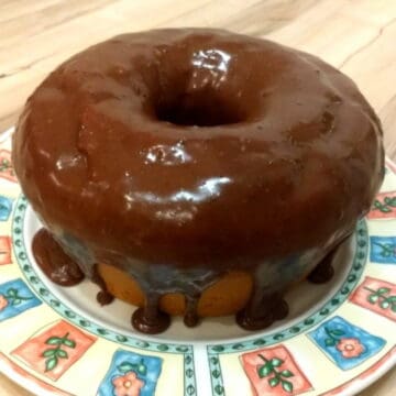 Brazilian carrot cake covered with brigadeiro frosting, on a plate