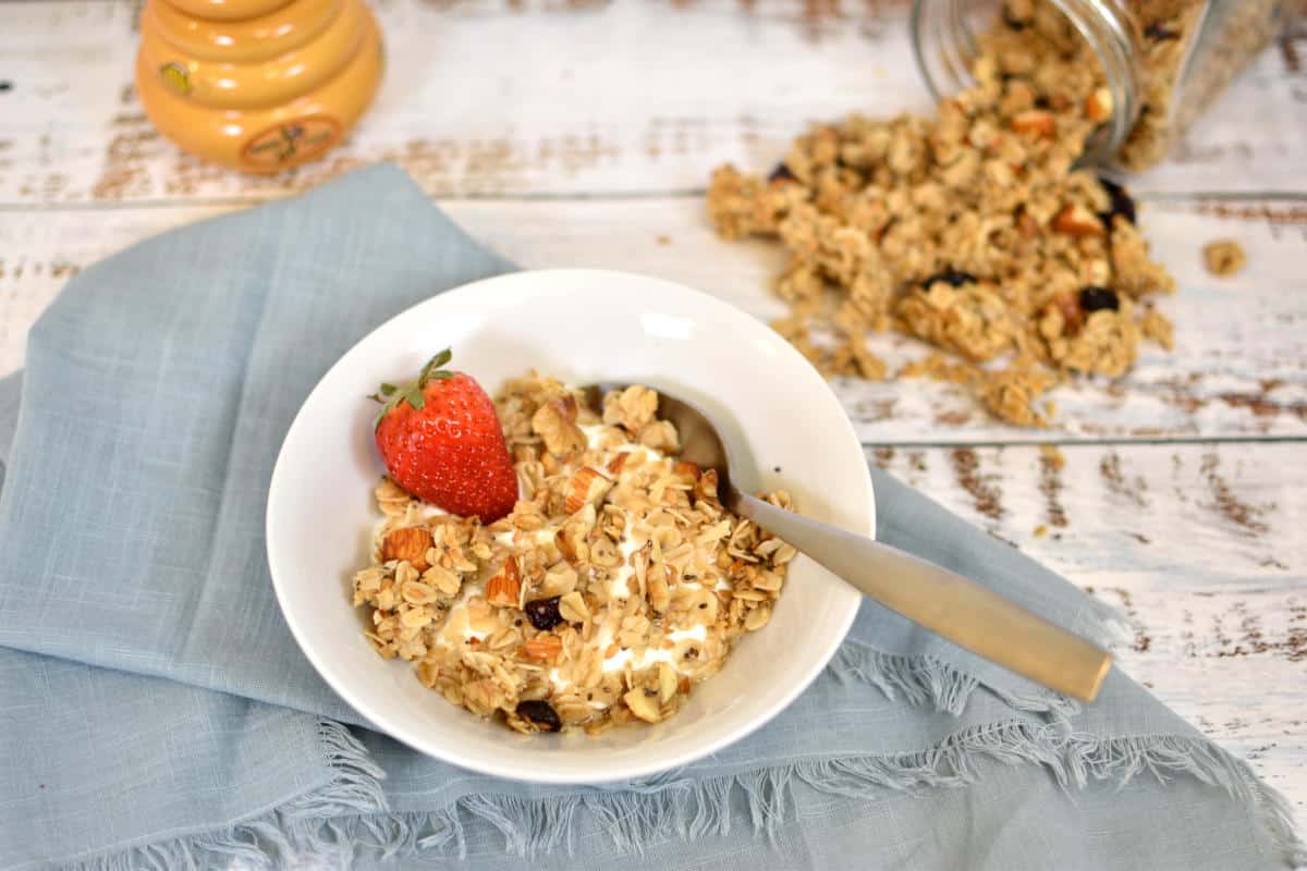 Healthy homemade granola in a bowl with strawberry