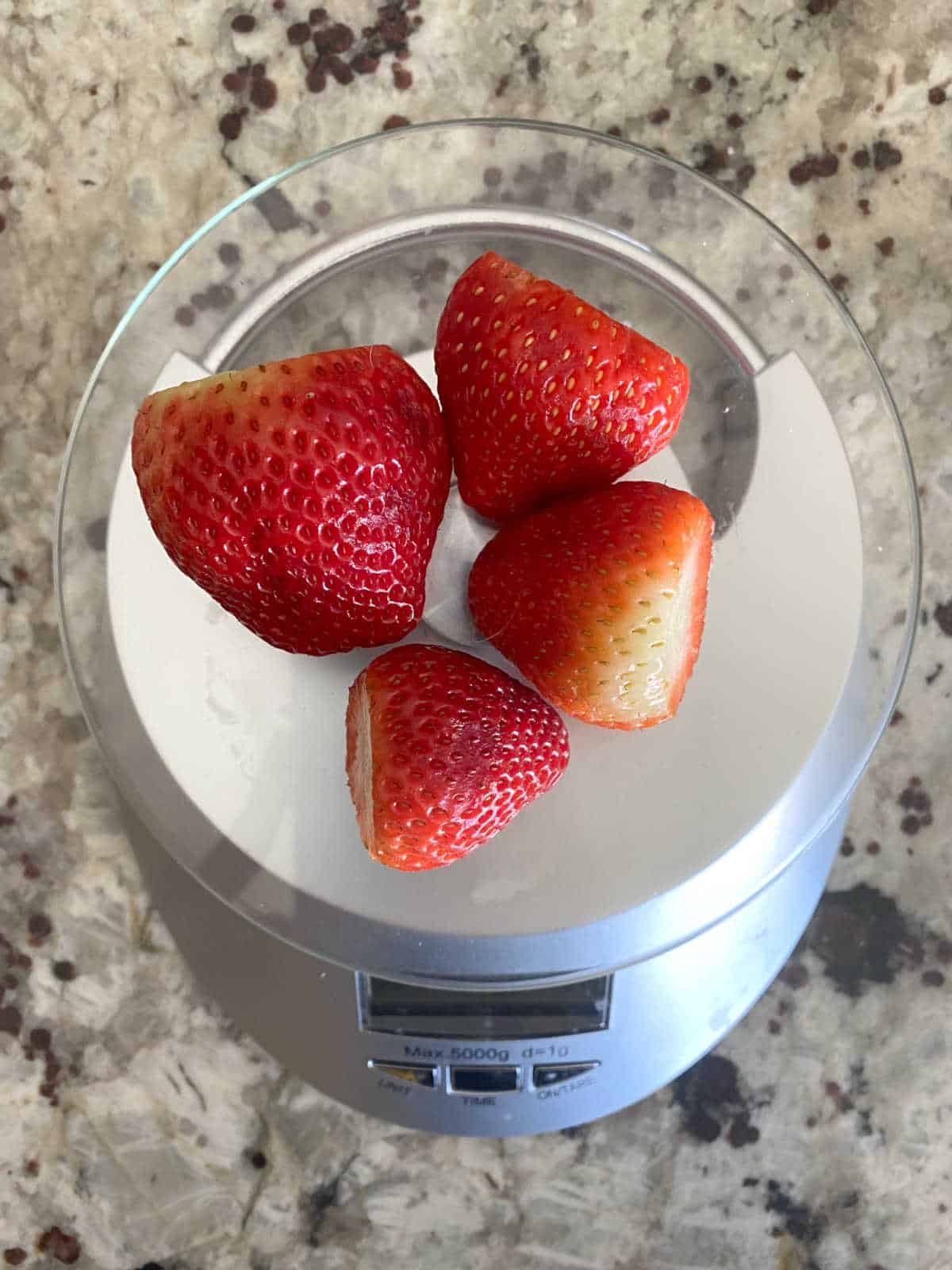 strawberries on a scale.
