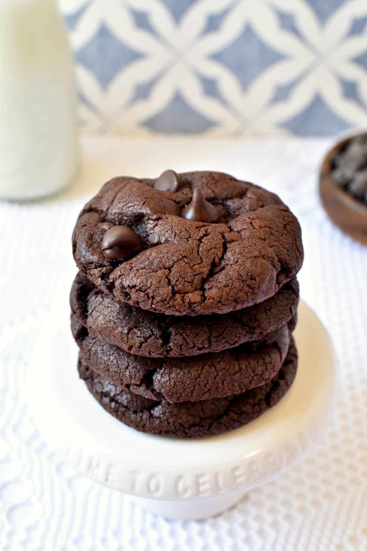 stack of chocolate chocolate chips cookies on a small stand.