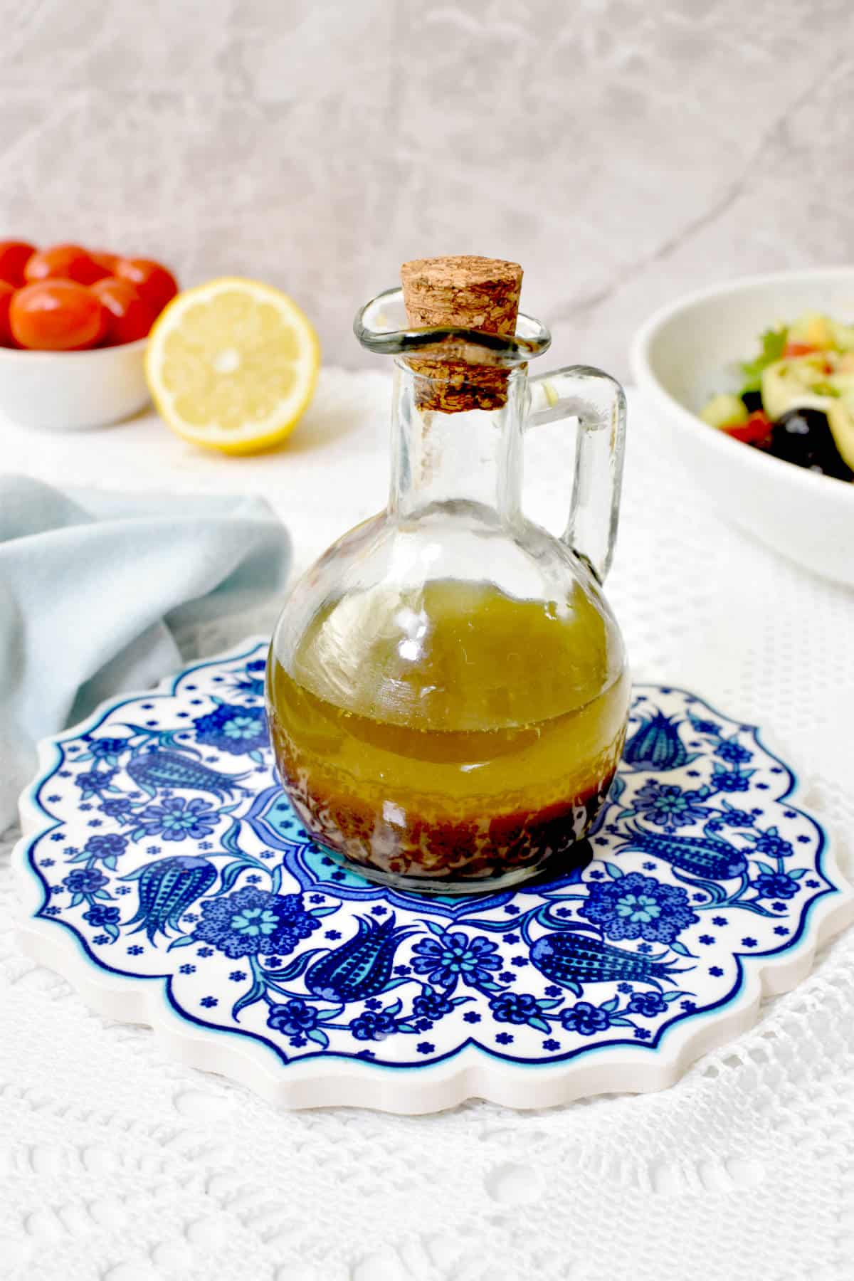 Mediterranean dressing in a glass container.