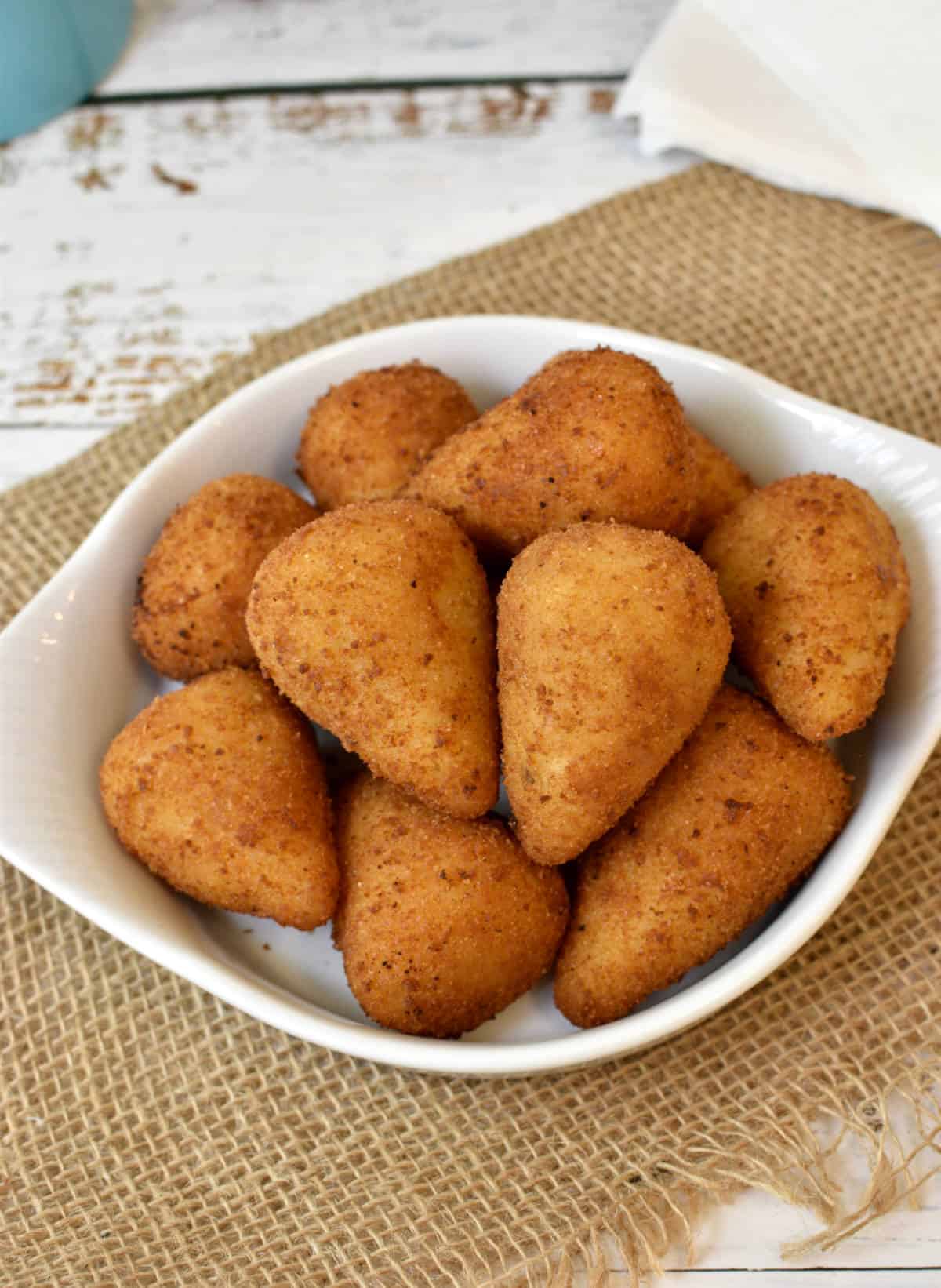 coxinhas piled in a little white dish