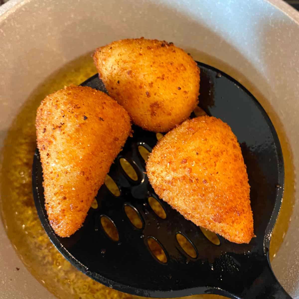 frying Brazilian chicken croquettes.