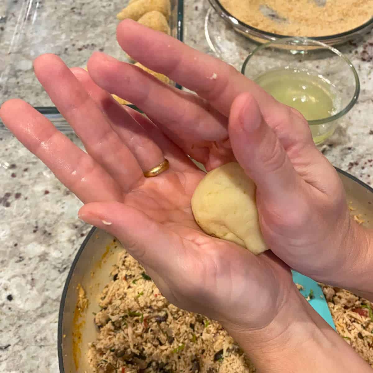shaping the dough in a teardrop form.