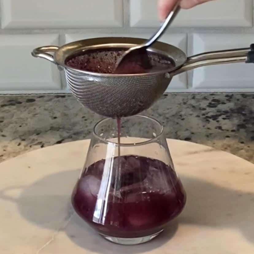 straining grape juice