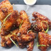 air fried chicken wings with sweet chili sauce.