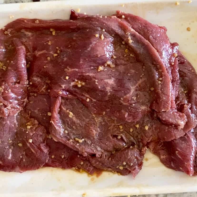 Milanesa steak marinating.