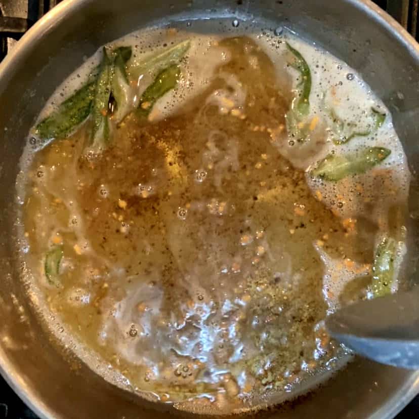 browned butter with garlic and sage in a pan.